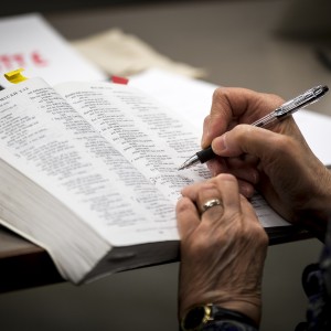 Hand annotating textbook